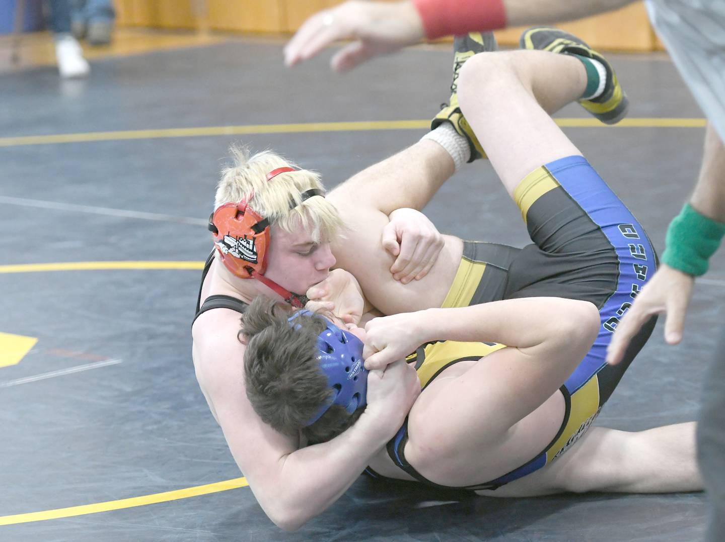 Fulton's Zane Pannell holds Durand's Logan Brown in the 170-pound title match at the Polo Wrestling Invitational.