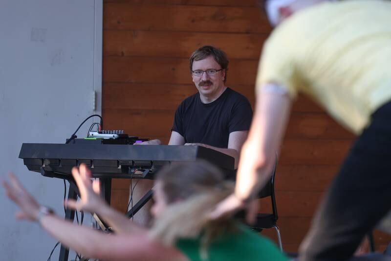 Erik Scheele plays the piano for an improv at the GreenRoom Improv show hosted by the Morris Library at Goold Park on Friday, Aug. 11, 2023 in Morris.