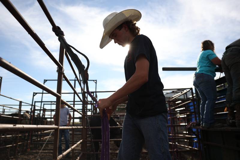 Dominic Dubberstine-Ellerbrock preps his reins before his bull ride. Dominic will be competing in the 2022 National High School Finals Rodeo Bull Riding event on July 17th through the 23rd in Wyoming. Thursday, June 30, 2022 in Grand Ridge.