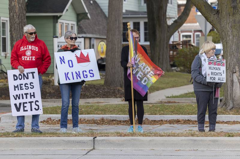 Protestors line up along Fourth Street in Sterling Saturday, Nov. 1, 2025, for another round of No Kings rallies.