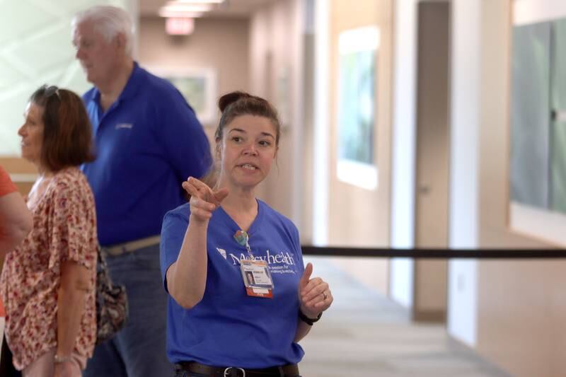 Nursing team lead Holly Peterson guides visitors during a public open house for the new Mercyhealth hospital in Crystal Lake on Saturday.