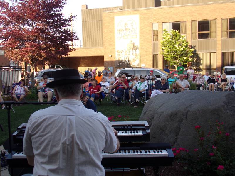 Spectators watched the Smokers Blues Band from lawn chairs and blankets Friday, June 2, 2023, at Heritage Park in Streator as the Jammin' at the Clock concert series kicked off.