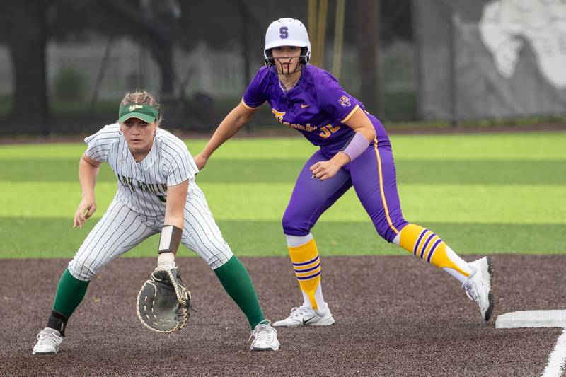 (00) J. Pinter of St. Bede watches opposing batter whilst (33) Emily Dormire of Sherrard leads off base on Tuesday, May 27, 2025 at Illinois Valley Central High School in Chillicothe.