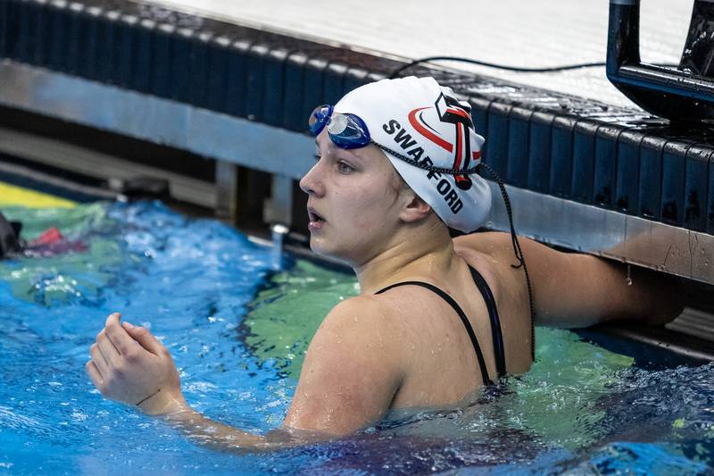 Bradley-Bourbonnais’s Aly Swafford checks the board after competing in the 50 Yard Freestyle during the IHSA Girls State Swimming Preliminaries at FMC Natatorium in Westmont on Nov. 14, 2025.