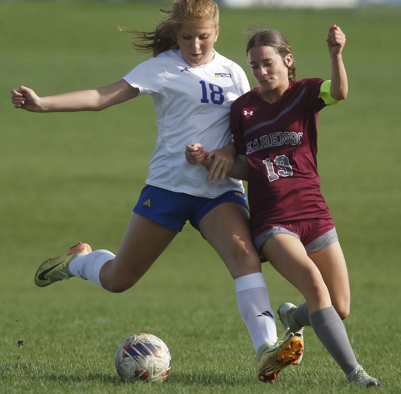 Johnsburg’s Maura Offling takes a shot at the goal as she is defended by Marengo's Regan Heimsoth during a Kishwaukee River Conference soccer match on Wednesday, April 15, 2026, at Marengo High School.