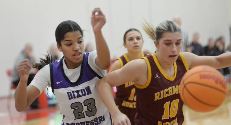 Dixon's Ahmyrie McGowan (23) and Richmond Burton's Daniella Mazzola (10) battle for a rebound at the Oregon Girls Basketball Tip-Off Tournament on Wednesday, Nov. 20, 2024 at the Blackhawk Center in Oregon.