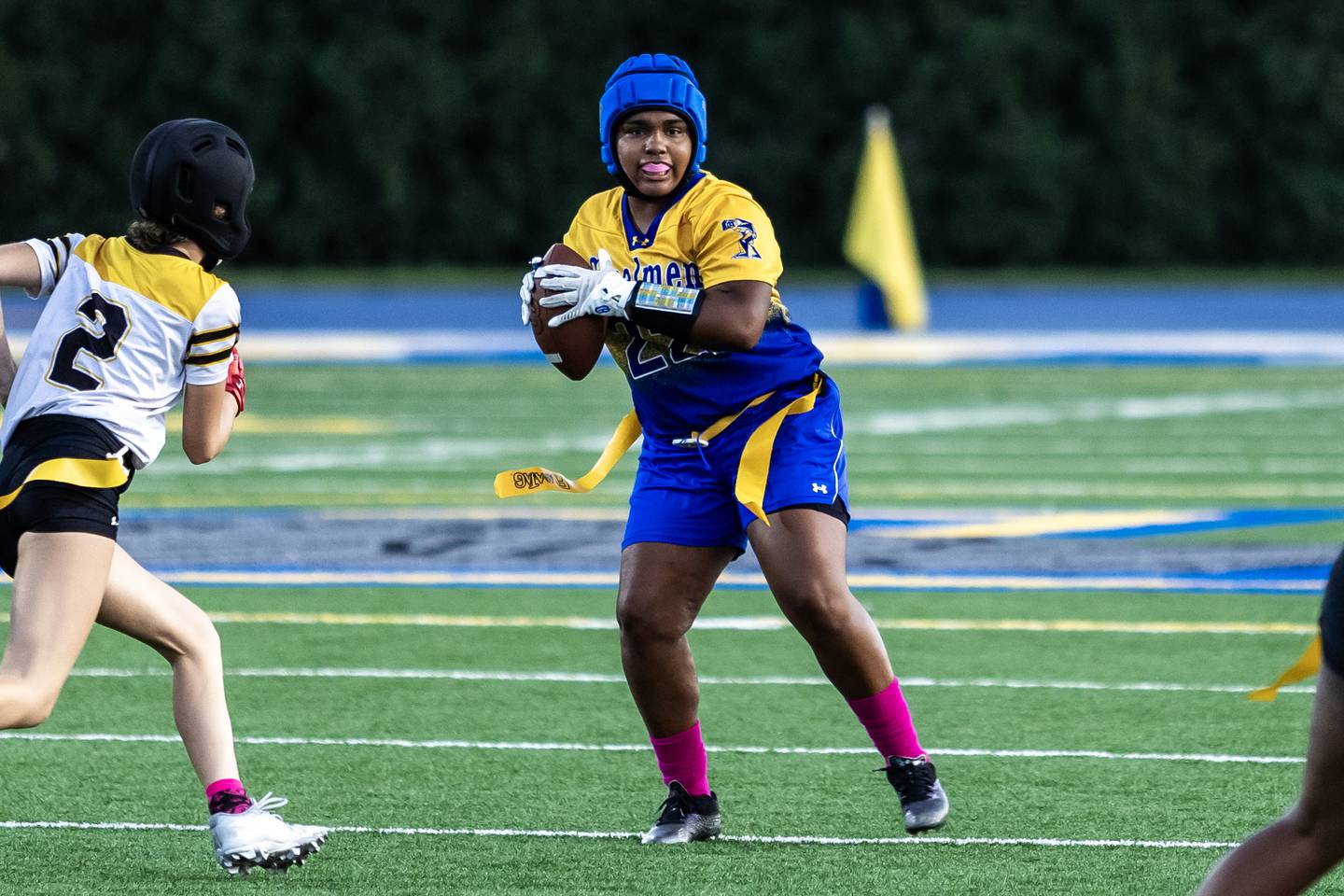 Joliet Central's Georgiana Majerus looks for an open teammate during a varsity flag football game at Joliet Central on Oct. 2, 2025.