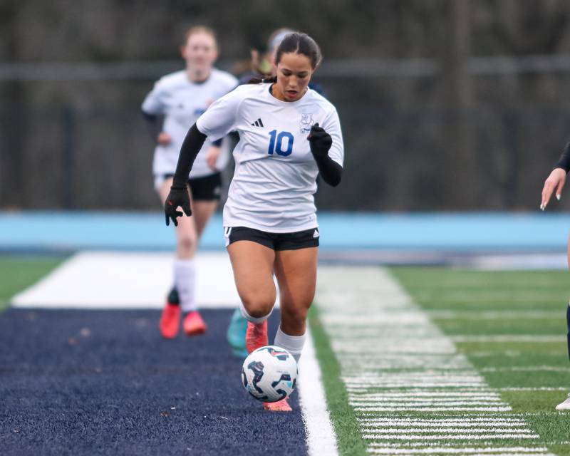 Riverside-Brookfield's Ella Caputo (10) advances the ball down the sidelines during soccer match between Riverside-Brookfield at Downers Grove South.  April 10, 2025.