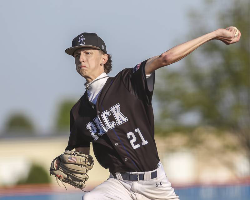 Oswego East's Austin Aguilera (21) delivers a pitch during baseball game Oswego East at Oswego.  May 14, 2026 in Oswego.