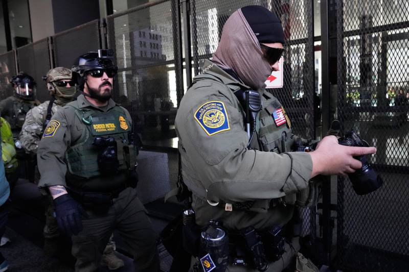 U.S. Customs and Border Patrol agents arrive to escort U.S. Customs and Border Patrol Gregory Bovino from federal court in Chicago, Tuesday, Oct. 28, 2025. (AP Photo/Nam Y. Huh)