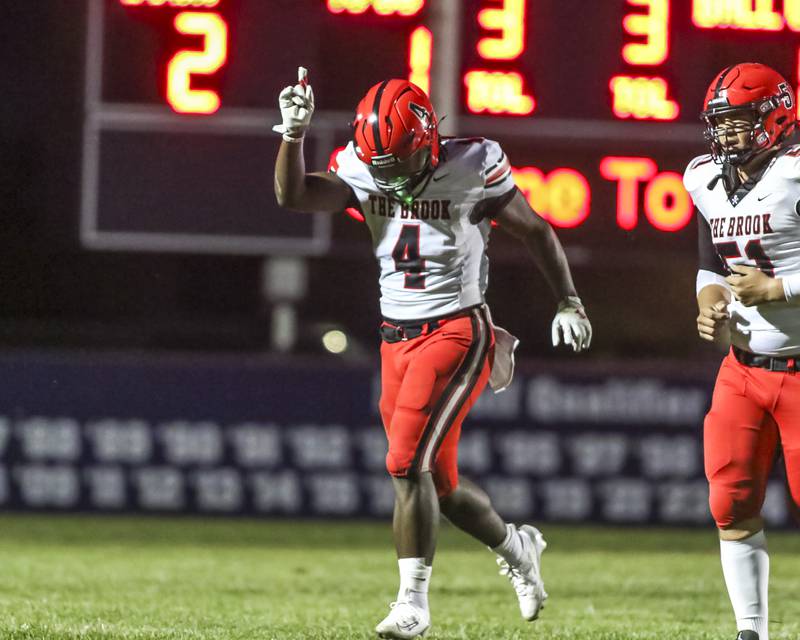 Bolingbrook's Timmie Lewis II (4) runs off the field after scoring a touchdown during football game between Bolingbrook at Oswego Friday, Sept 12, 2025  in Oswego.
