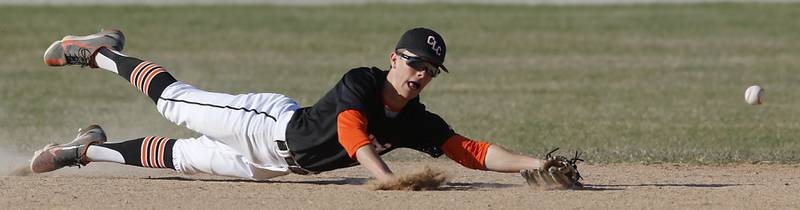 Crystal Lake Central's James Dreher tries to field there ball during a Fox Valley Conference baseball game against Jacobs Monday, April 10, 2023, at Crystal Lake Central High School.