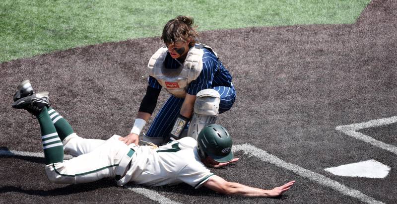 Joe Lewnard/jlewnard@dailyherald.com
Grayslake Central’s Jack Gerbasi is tagged out at the plate by Nazareth catcher Collin Roche during the first inning of the Class 3A state championship baseball game in Joliet Saturday.