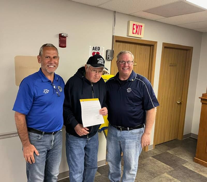 Mike Stier (middle) receives his Sheffield Lions Club 40-year chevron from Tom Drez (left) and Al Corwin.