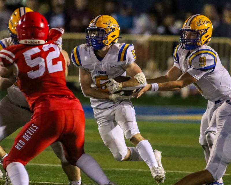 Lyon's Danny Caroll (5) takes off up the middle after getting the handoff during football game between Hinsdale Central at Lyons.  Sept 8, 2023.