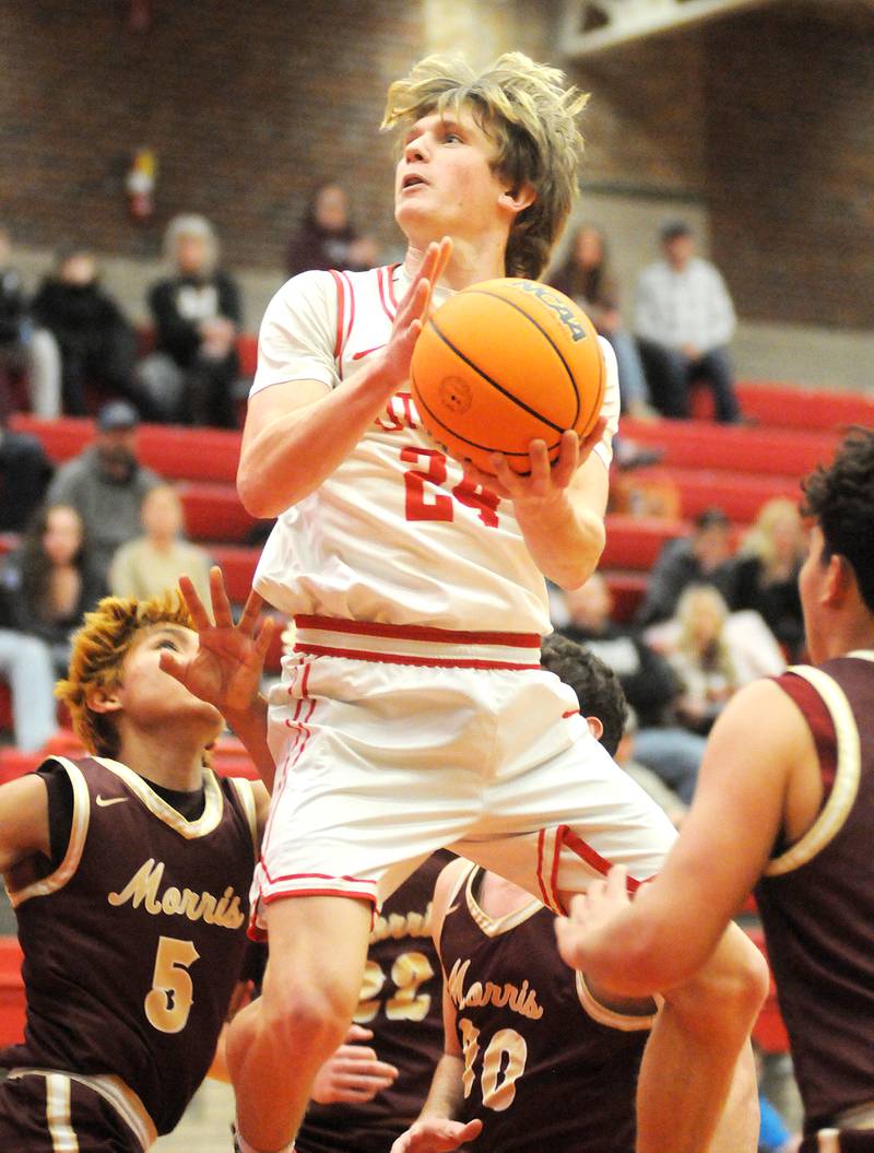Ottawa junior George Shumway (24) eyes the basket during the home game against Morris on Friday, Dec. 12, 2025 at Kingman Gym.