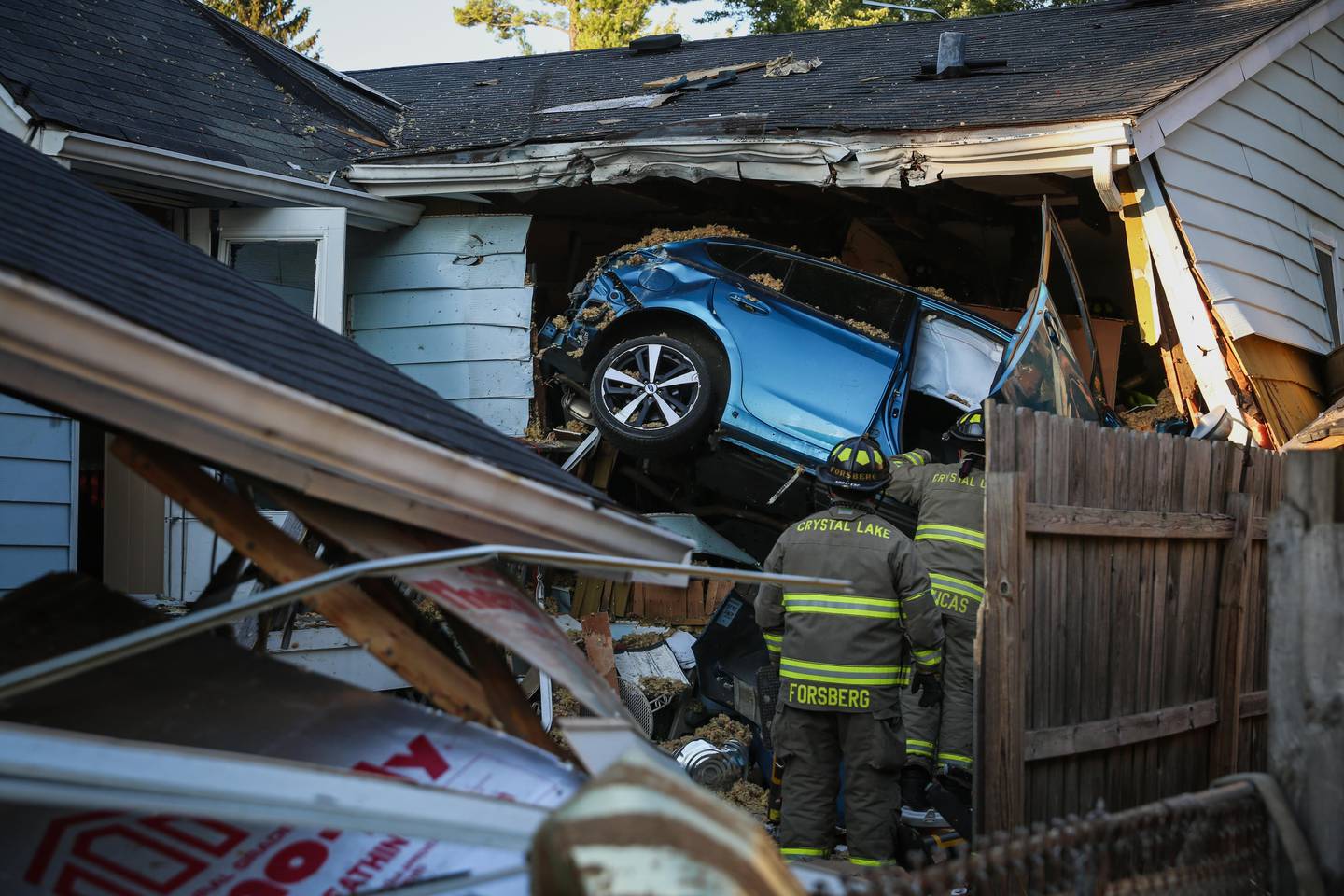 A vehicle crashed into a detached garage and home in Crystal Lake Wednesday, July 27, 2022, causing two people to sustain life-threatening injuries.
