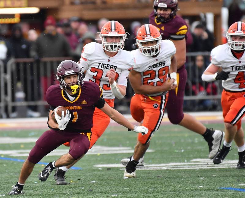 Montini's Santino Florio (1) leaves three Byron defenders behind during a Class 3A second-round game on November 9, 2024 at Montini Catholic High School in Lombard.