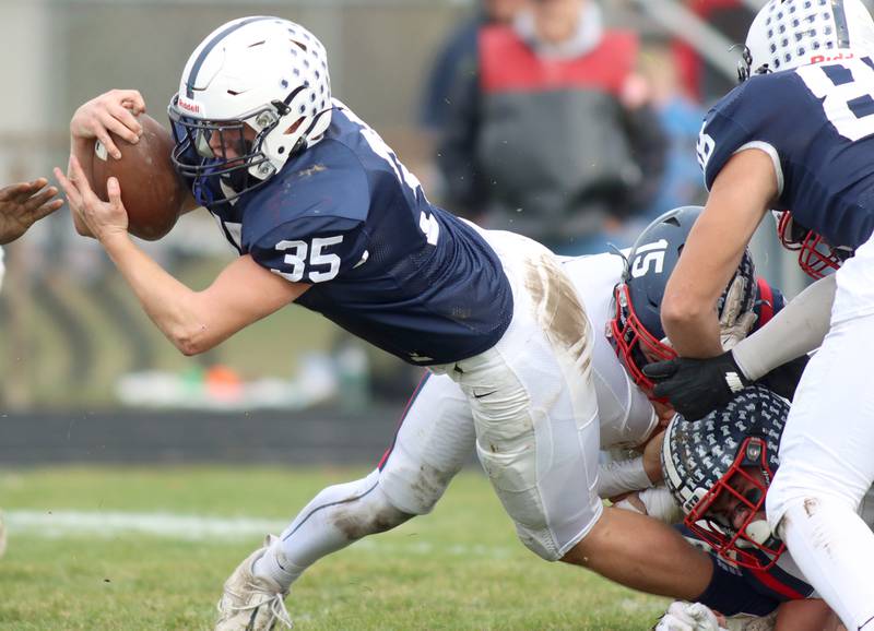 Cary-Grove’s Michael Massat dives for yardage against Belvidere North in IHSA Class 6A quarterfinal playoff football action on Saturday, Nov. 16, 2024, at Al Bohrer Field on the campus of Cary-Grove High School in Cary.