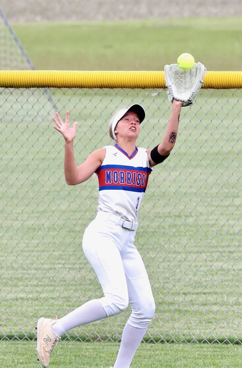 Morrison center fielder Kaylee Pruis shags a fly ball during Saturday's regional finals in Princeton. The Fillies beat Princeton 9-0 to advance to the Class 2A Woodstock Marian Sectional on Wednesday.
