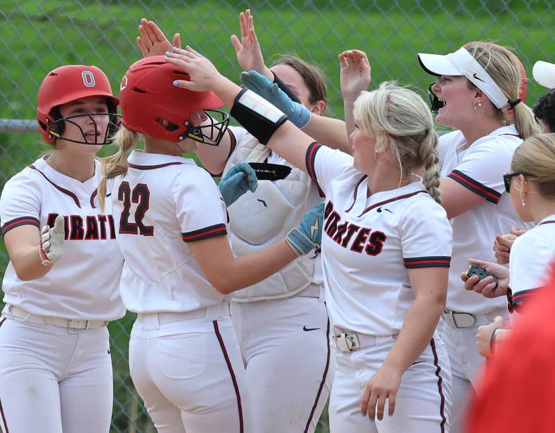 Ottawa's Joslyn Rose is greeted at home plate after homering Friday, April 17, 2026, during thier game at Sycamore High School.