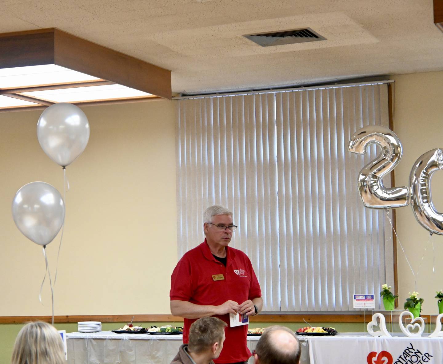 Voluntary Action Center of Northern Illinois CEO Nate Kloster makes a speech during Thursday's celebration.