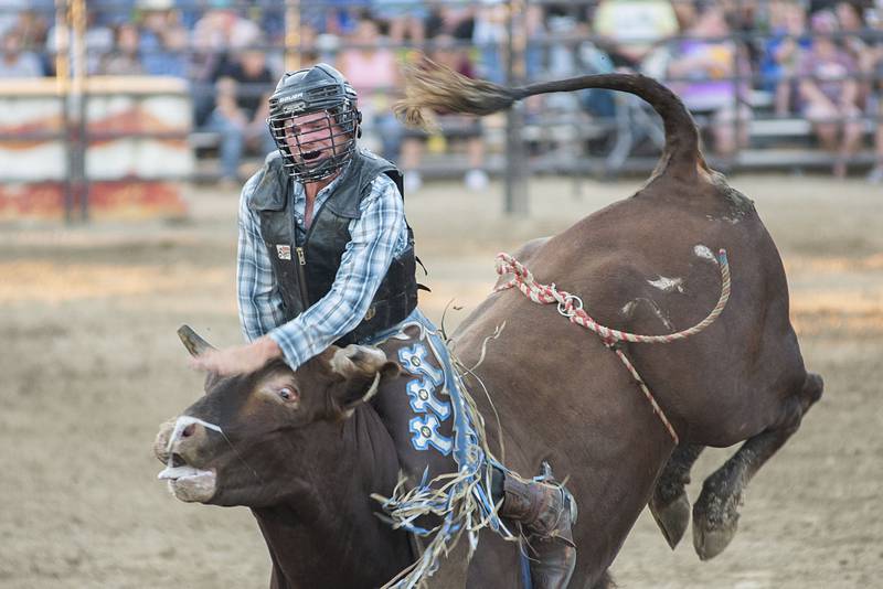 Cody Kraabel steadies himself on August 16, 2022 during action at the Whiteside County fair. The Next Level Pro Bull Riding tour made a stop Tuesday in Morrison.