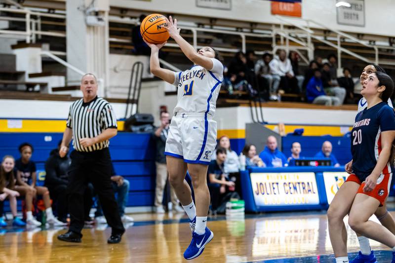 Joliet Central's Elena Moody goes for a layup during a varsity girls basketball game against Romeoville at Joliet Central on Dec. 18, 2025.