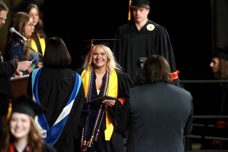 Batavia High School graduate Faith Borre crosses the stage during the school’s 2025 commencement ceremony on Wednesday, May 21, 2025 at Northern Illinois University in DeKalb.