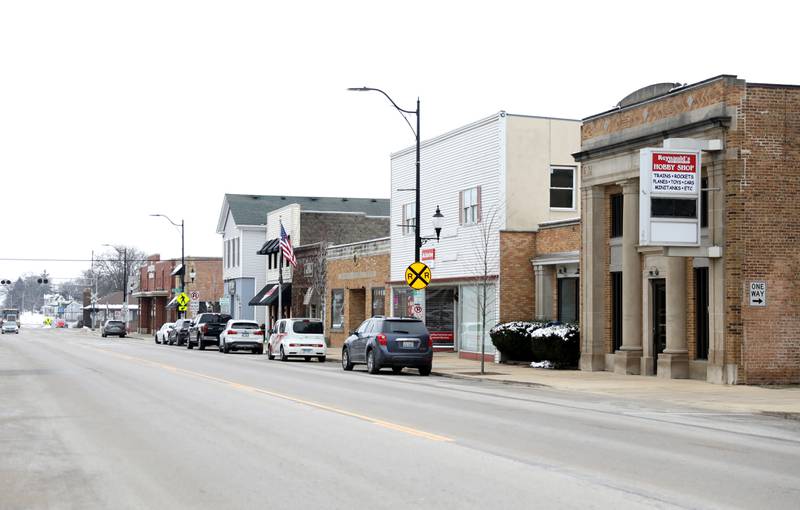 Thirty-eight asylum seekers arrived via bus at the Elburn Metra station Dec. 22, 2023. Thirty-two got on the train, while four were picked up by family.