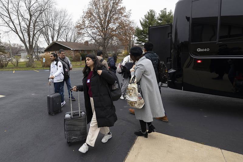 University of Chicago students file off a bus Wednesday, Nov. 27, 2024, in Rock Falls. The students will be meeting their host families to whom they will be staying with the next four days.