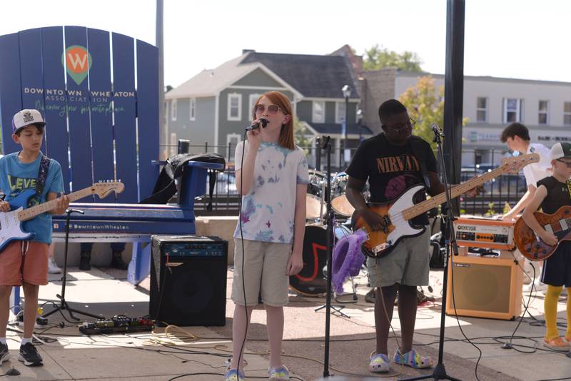 Members of the band Definition of Chaos from the Jerry Evans School of Music in Wheaton perform during the Music on Main event held Saturday, Sept. 21, 2024.
