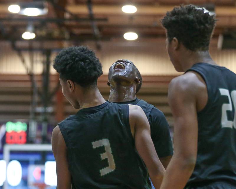 Glenbard West's Josh Abushanab (10) celebrates a basket with TJ Williams (3) during their basketball game between Glenbard West at Downers Grove North. Jan 24, 2025 in Downers Grove.