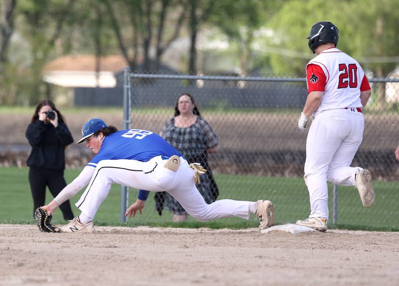 Hinckley-Big Rock's Martin Ledbetter stretches for the ball forcing Indian Creek's Derrick Milostan out on a close play during their game Monday, April 29, 2024, at Indian Creek High School.