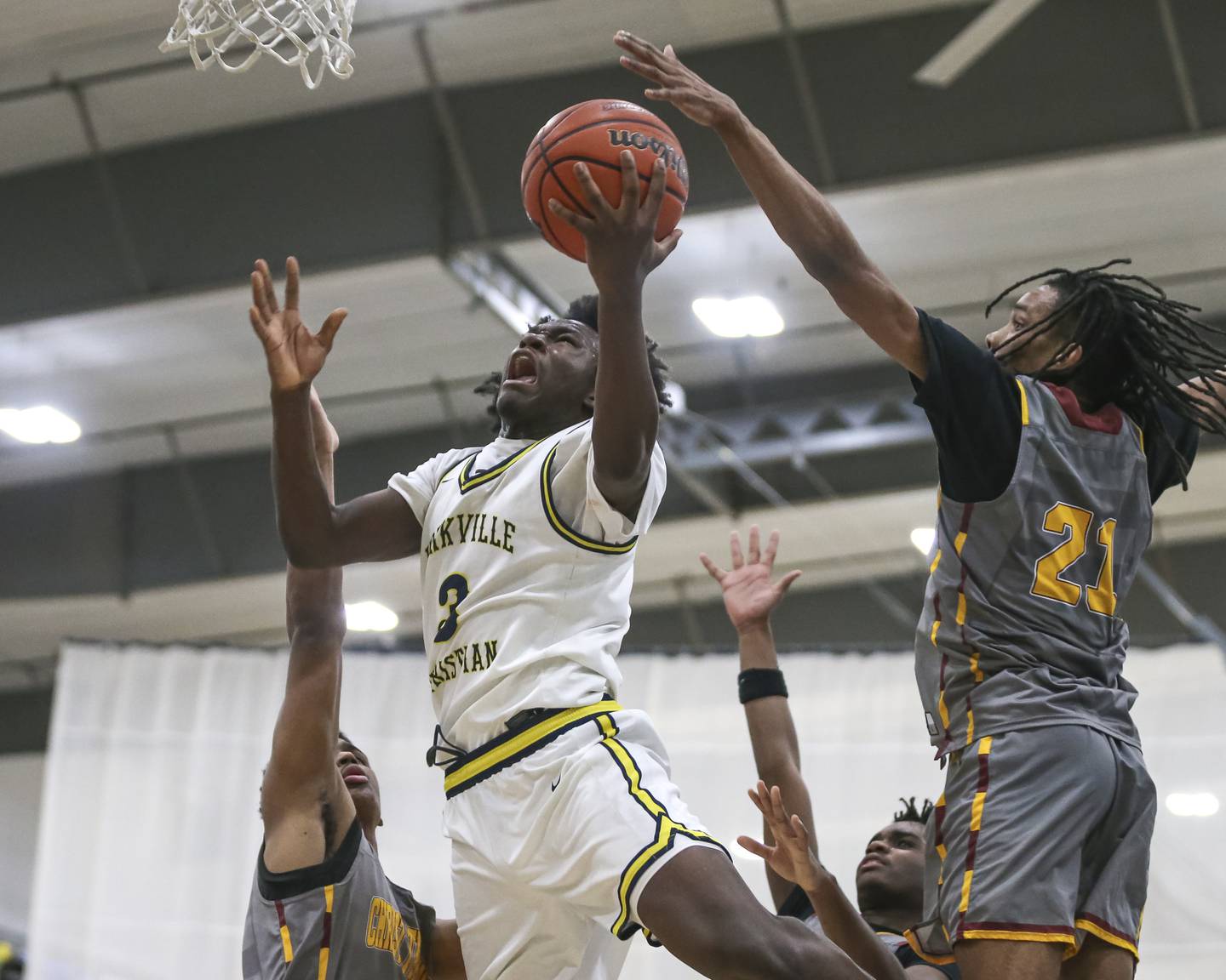 Yorkville Christian's Jayden Riley (3) hangs in the air while putting up a shot during their basketball game between Christ the King at Yorkville Christian, Feb 6, 2026 in Yorkville.
