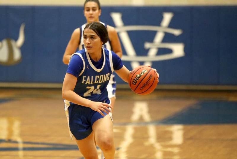 Wheaton North’s Sara Abdul drives toward the basket during a game at Geneva on Friday, Dec. 22, 2023.