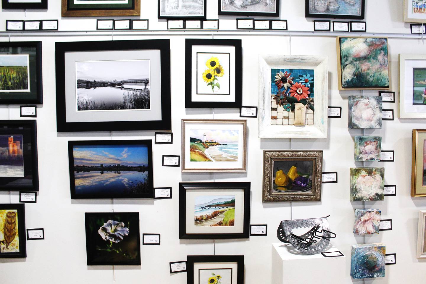 Works of art hang on the wall June 19, 2025, at The Loft on Main art gallery in Morrison.