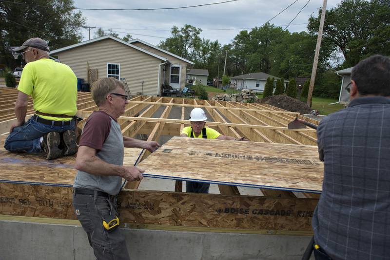 Volunteers and Habitat's regular "band of brothers" get to work putting in subfloor Saturday at the home in DIxon. The group always has a hope to get the new home owners in in time to host Thanksgiving dinner. So far things are looking good with the build being ahead of schedule.