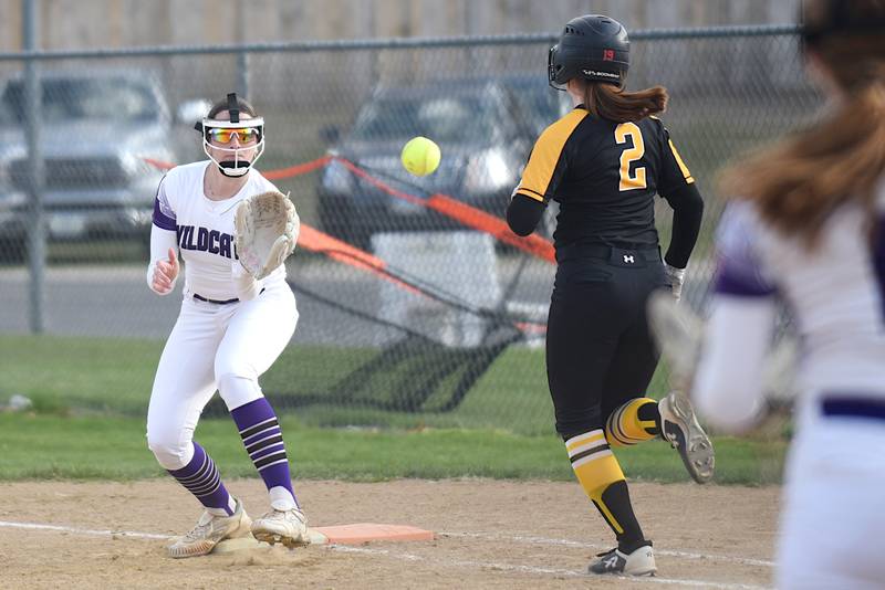 Wilmington's Ally Allgood, left, fields a throw at first base ahead of Herscher's Lily Tucek during a game at Wilmington Tuesday, April 15, 2025.