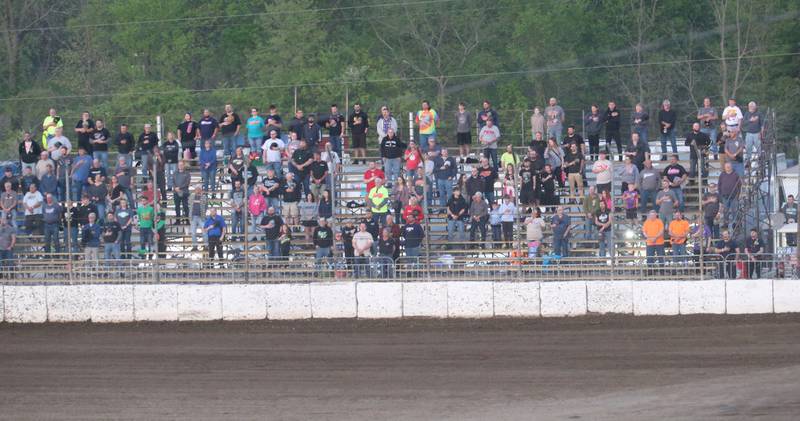 Fans stand for the Nationsl Anthem during the season opening race on Tuesday, May 6, 2025 at La Salle Speedway.