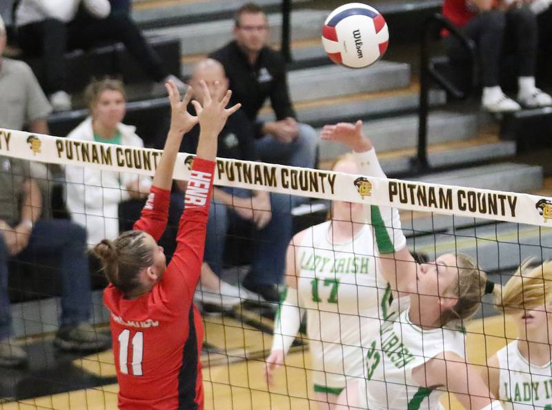 Seneca's Tessa Krull spikes the ball past Henry-Senachwine's Alison Mitchell during the Tri-County Conference championship game on Thursday, Oct. 16, 2025 at Putnam County High School.