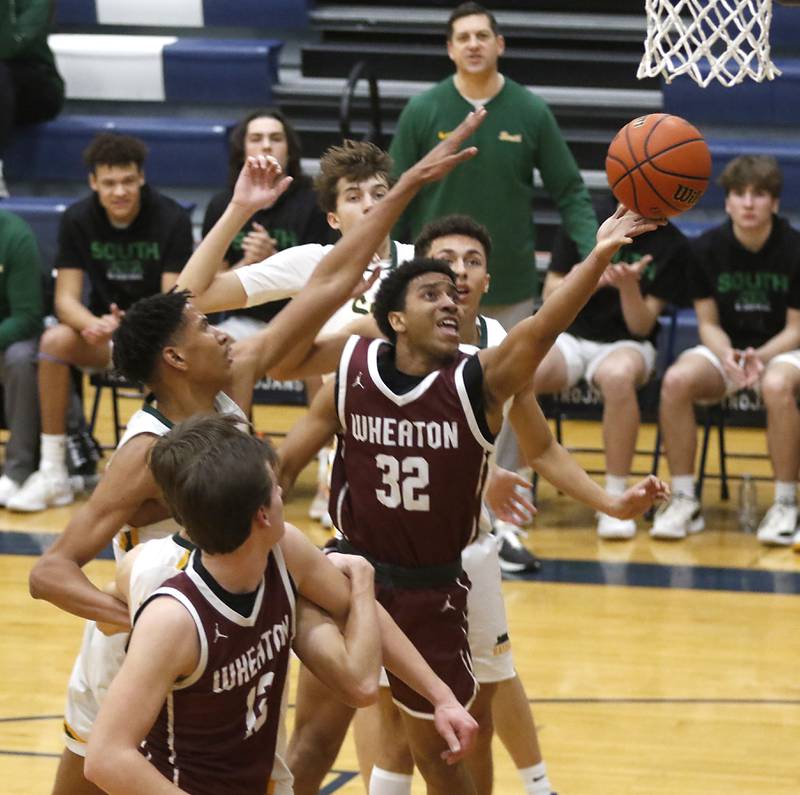 Wheaton Academy's Wandy Munoz drive to the basket against the Crystal Lake South defense during the IHSA Class 3A Cary-Grove Boys Basketball Regional Championship game on Friday, Feb. 23, 2024 at Cary-Grove High School.