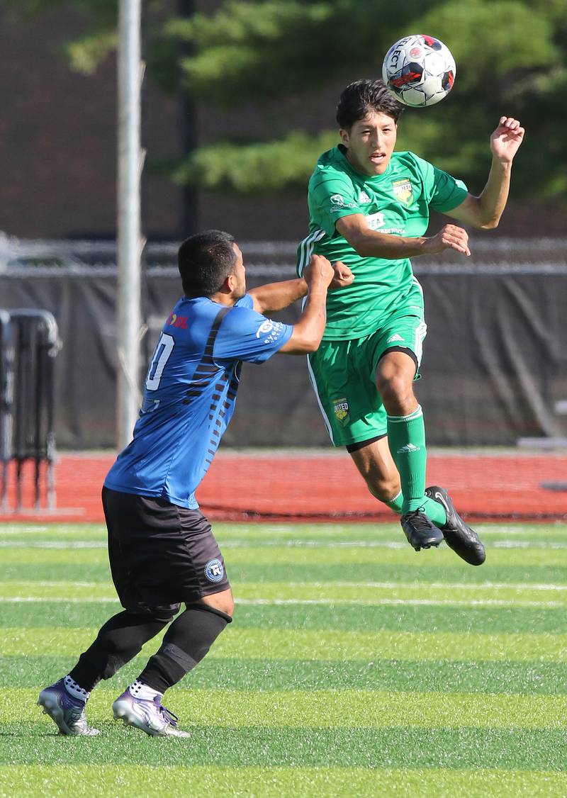DeKalb County United's Oscar Montejano (right) heads the ball away from Rockford FC’s Erik Manriquez during their game Saturday, July 29, 2023, at the Soccer & Track and Field Complex at Northern Illinois University in DeKalb.