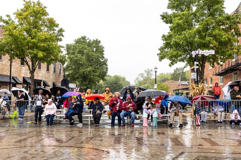 Spectators brave the rain to watch the Plainfield Community Homecoming Parade on Sept. 28, 2024.