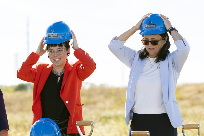 Alderman at large Kaitlyn Ekquist (left) and Sterling mayor Diane Merdian don hardhats for the ground breaking photo of the Sterling riverfront park project Tuesday, October. 1, 2024.