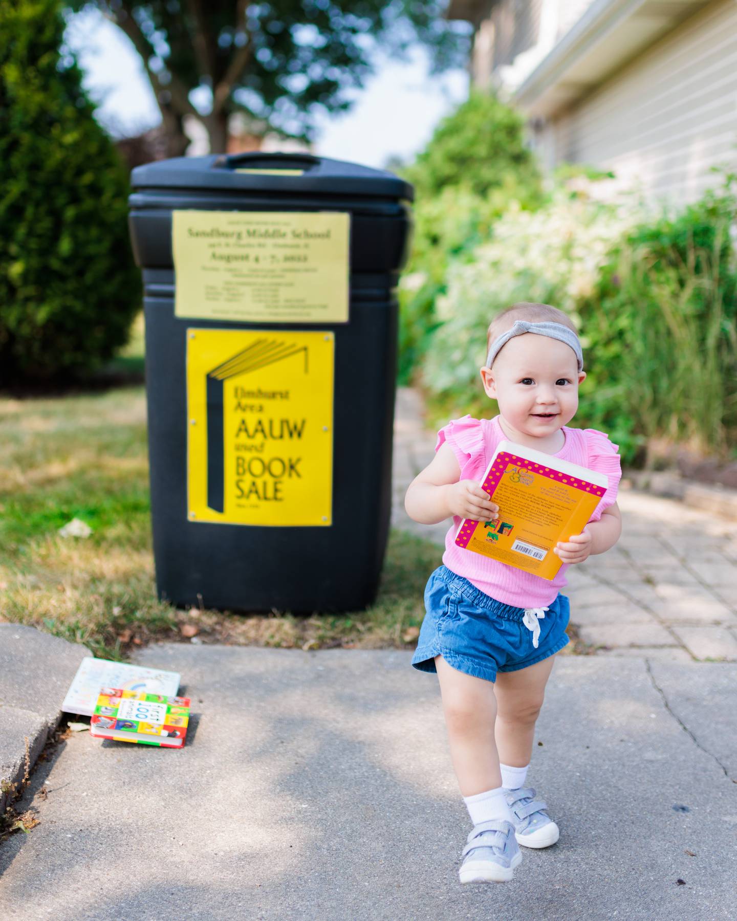Hailey Klenck donates books, as people look forward to the Elmhurst AAUW Used Book Sale August 4-7 at Sandburg Middle School in Elmhurst.