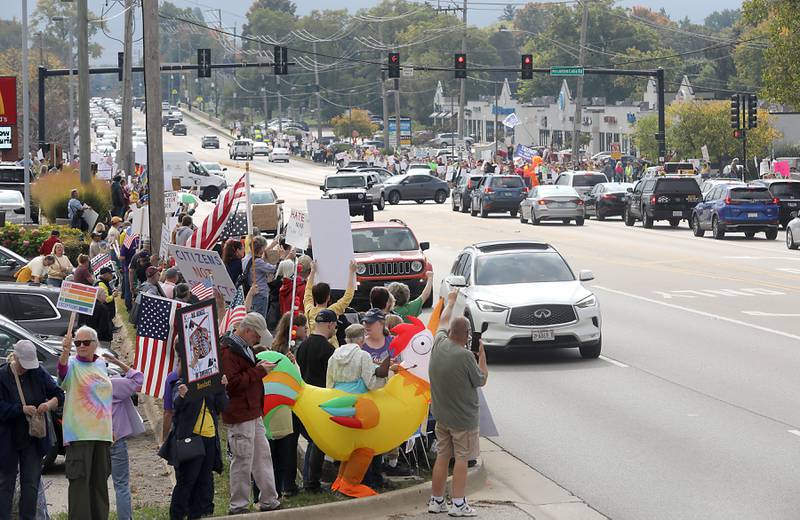 Protesters line Route 31 during a "No Kings” protest rally on Saturday, Oct. 18, 2025, in McHenry. The protest drew thousands of protesters to the area to protest the policies of President Donald Trump.
