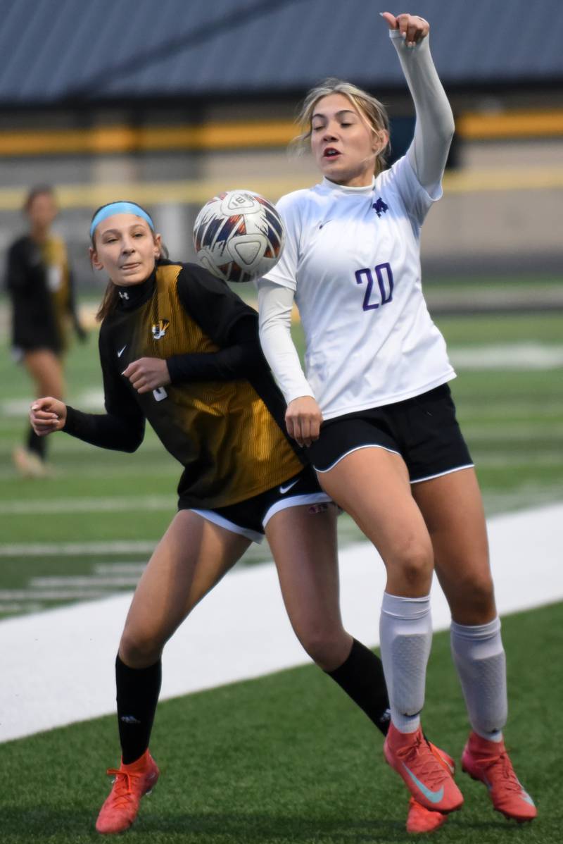 Herscher's Gianna High, left, and Manteno's Madison Borrman battle for a ball during a game at Herscher Tuesday, May 5, 2026.