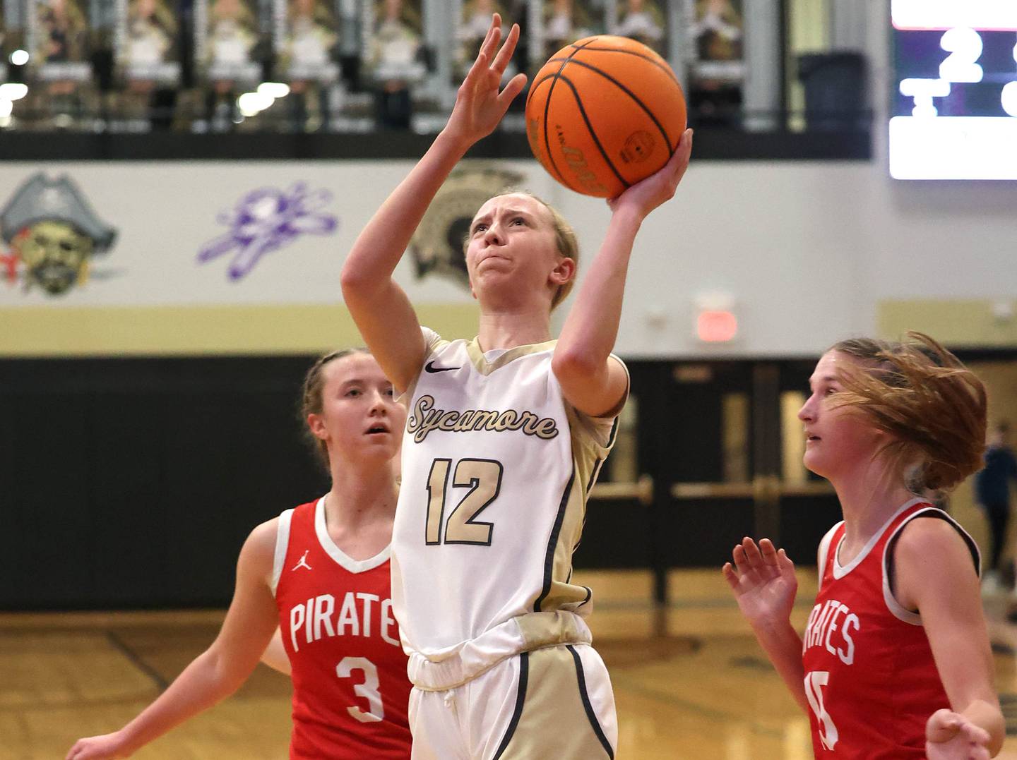 Sycamore's Sadie Lang gets to the basket between Ottawa's Skylar Dorsey (left) and Hailey Larsen during their game Friday, Jan. 10, 2025, at Sycamore High School.