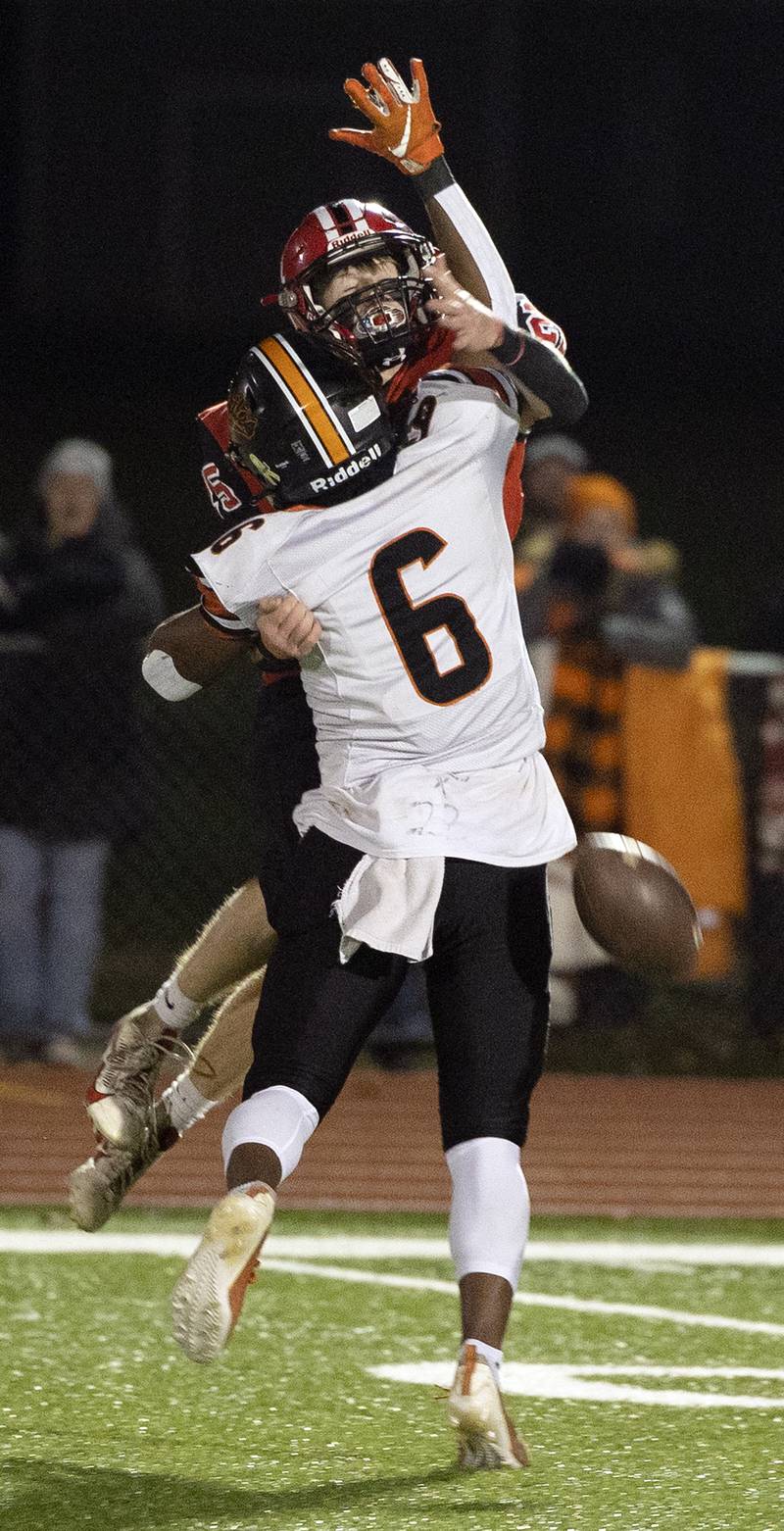 Milledgeville’s Micah Toms-Smith breaks up a pass intended for Amboy’s Ed Fry Friday, Nov. 22, 2024, during the 8-man football championship in Monmouth.